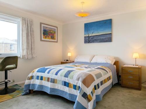 a bedroom with a bed and a window at 2 Seafield Terrace, Bognor Regis in Bognor Regis