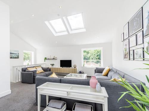 a living room with a couch and a table at High Trees View in Knaresborough
