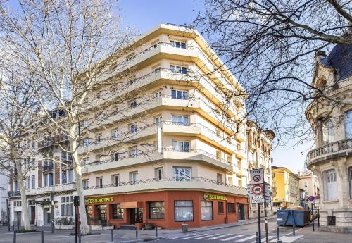 a large building on a street in front of a building at B&B HOTEL Perpignan Centre in Perpignan