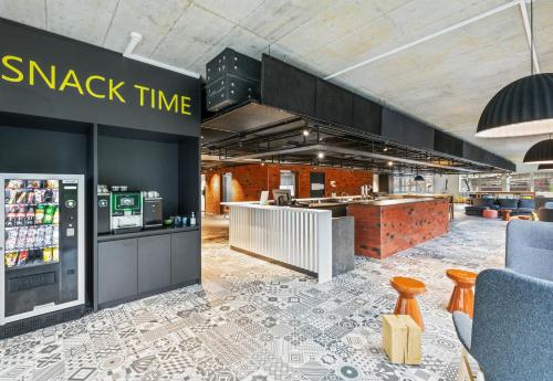 a store with a snack time counter in a store at B&B HOTEL St Gallen in St. Gallen