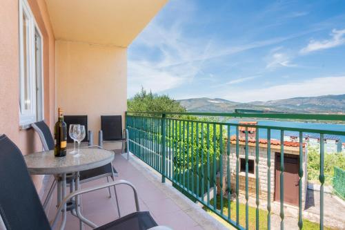 a balcony with a table and a view of the water at Blue Horizon Retreat in Trogir