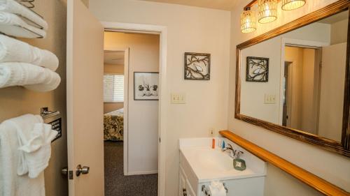 a bathroom with a sink and a mirror at Lakefront Bungalow with Community PoolHot Tub #1 in Lakeway