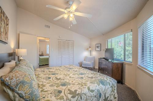 a bedroom with a bed and a ceiling fan at Lakefront Bungalow with Community PoolHot Tub #1 in Lakeway