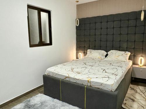 a bedroom with a bed and a mirror and a window at Appart Angel in Espargos