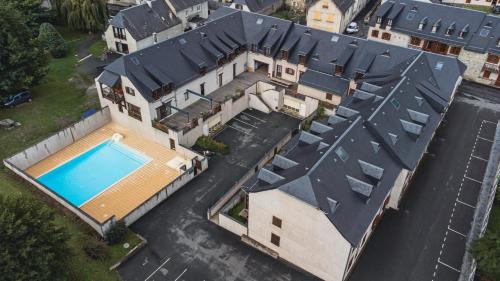 an aerial view of a house with a swimming pool at Résidence Vignec Village by Actisource in Vignec