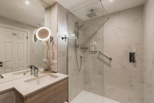 a bathroom with a shower and a sink at The Borrowdale Hotel in Keswick