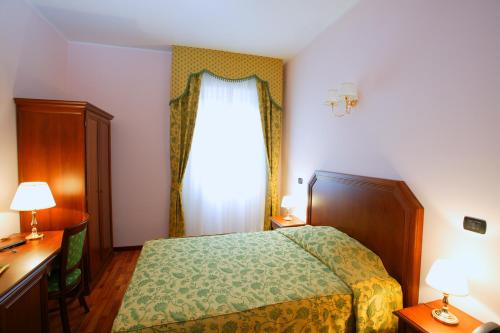 Postel nebo postele na pokoji v ubytování Hotel La Torretta