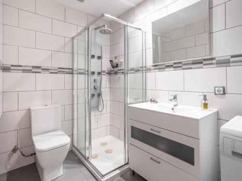 a bathroom with a shower and a toilet and a sink at Paradise Beach - Seaviews - BBQ - Large Terrace - Pool & Pool Bar in Playa Paraiso