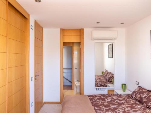 a small bedroom with a bed and a hallway at Paradise Beach - Seaviews - BBQ - Large Terrace - Pool & Pool Bar in Playa Paraiso