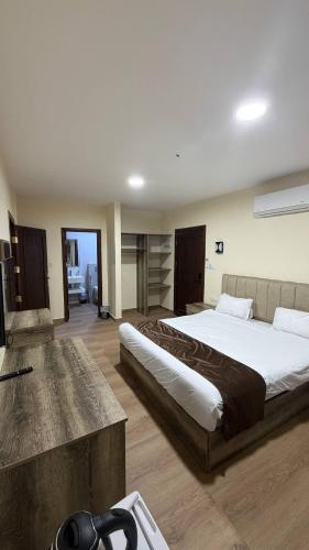 a bedroom with a large bed in a room at Selena Hotel Aqaba in Aqaba