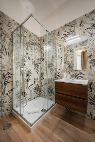 a bathroom with a shower and a sink at Aroma Rooms Procida in Procida