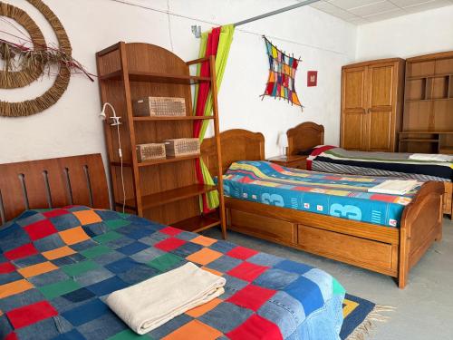 a room with two beds and a bunk bed at MONTE DA ADEGA in Vale de Água