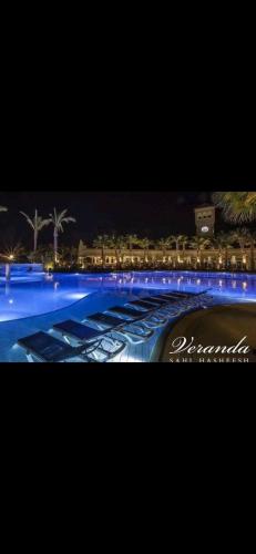 a picture of a pool at a resort at night at Veranda resort in Hurghada