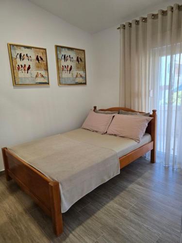 a bedroom with a bed in a room at Villa Crown Silvia in Dobra Voda