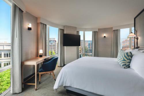 a hotel room with a bed and a desk at The Beacon at Embassy Row, WorldHotels Distinctive in Washington, D.C.