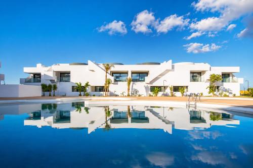 a house with a pool in front of it at Ático de Lujo con Jacuzzi Privado en Azotea Vistas in La Oliva