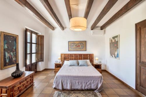 a bedroom with a bed and two tables at Apartamento II Els Cucons in Sant Pere de Ribes