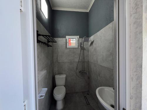 a bathroom with a toilet and a sink at Resort In Gonio in Kvariati