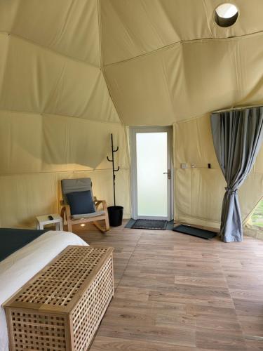 a bedroom with a bed in a tent at Pen-Y-Fan Glamping - Luxury Geodomes in Sennybridge
