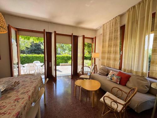 a living room with a couch and a table at Villa Lilly in Grado