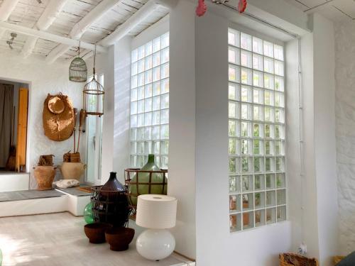 a room with white walls and large windows at Casa Tranquila in Tózar