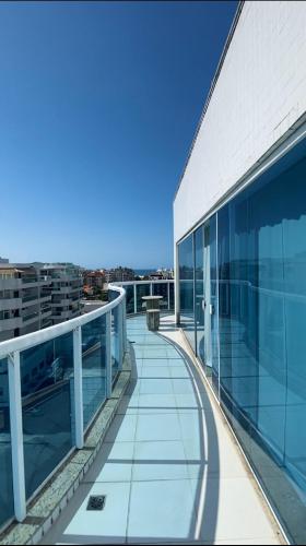 a balcony of a building with a view of the city at Hotel Real in Cabo Frio