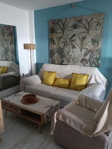 a living room with a couch and a coffee table at Apartamento La Bella Vista ATBA00361 in Zafra