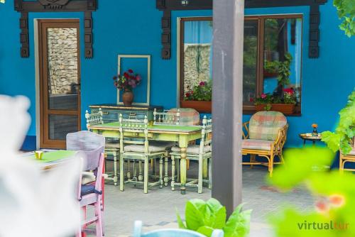 a dining room with a table and chairs at Resedinta Rotundu in Butuceni