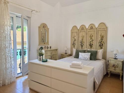 a bedroom with a large bed with a large headboard at Chalet Amarena 20812 in Argoños