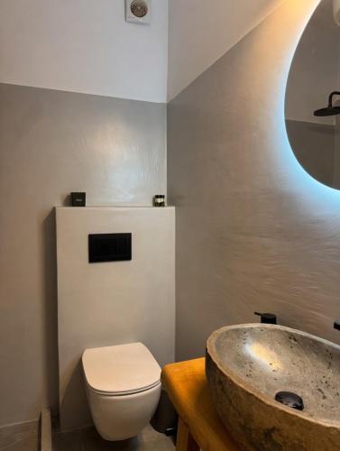 a bathroom with a sink and a toilet at Ovio II in Kampos Paros