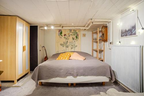 a bedroom with a bed in a small room at Cozy summer apartment in Archipelago in Öckerö