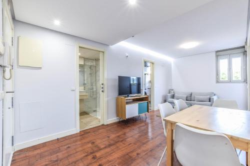 a living room with a table and chairs at The Corporate Residence & Parking in Madrid