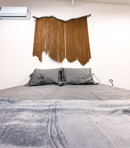 a bedroom with a bed with a curtain above it at Loft Misiones 226 in Puerto Iguazú