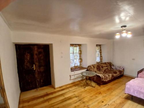 a living room with a couch and a table at Vardeni Guest house in Dsegh