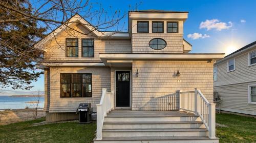 a house with a front porch and a door at Robbins Nest in Essex