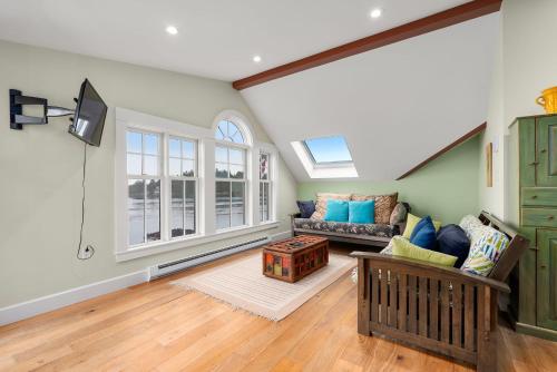a living room with a couch and a window at Robbins Nest in Essex