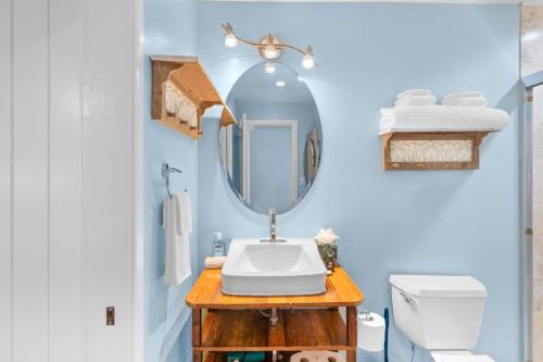 a bathroom with a sink and a mirror at Kona Mansions#208 in Kailua-Kona