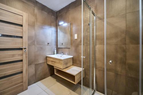 a bathroom with a sink and a shower at Beautiful View, 3 Bedroom Spacious Apartment in Tal-Pietà