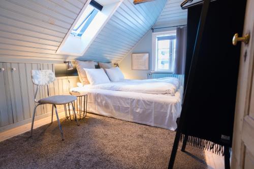a bedroom with a bed with a blue ceiling at Reykjavík Treasure B&B in Reykjavík