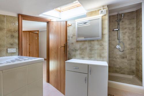 a bathroom with a sink and a shower at Family friendly apartment in Giba Center in Giba