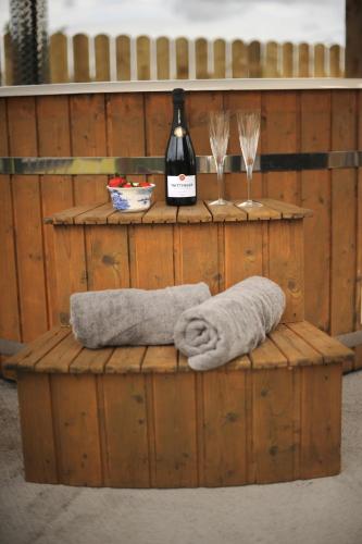 a wooden barrel with a bottle of wine and a towel at The Barraghan in Derrygonnelly