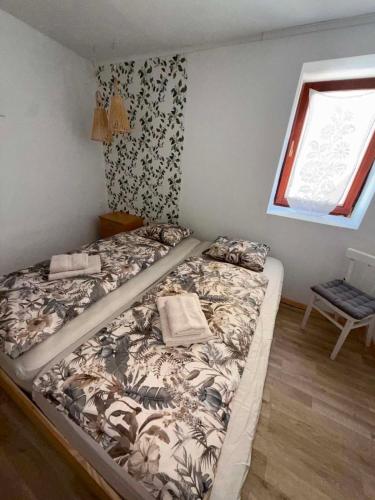 a large bed in a room with a window at 3 bedroom Apartman Izolana in Izola