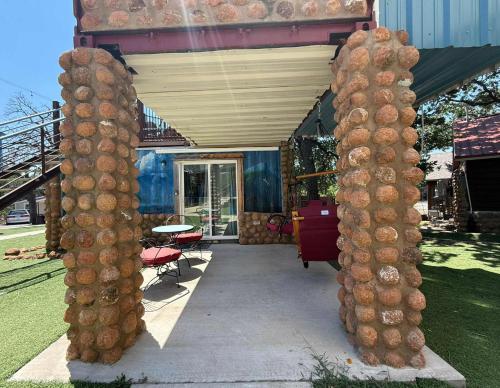 a group of tall columns in front of a building at PPI Native American Theme suite in Medicine Park
