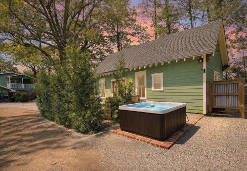 a small house with a hot tub in front of it at Island Retreat - Great for Large Groups in Charleston
