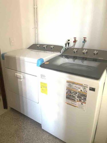 a kitchen with a stove and a sink at Villa Evelia, Pool, Near Nuevo Vallarta in Mezcales