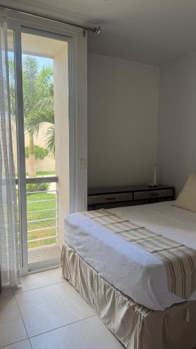 a bedroom with a bed and a large window at Villa Evelia, Pool, Near Nuevo Vallarta in Mezcales