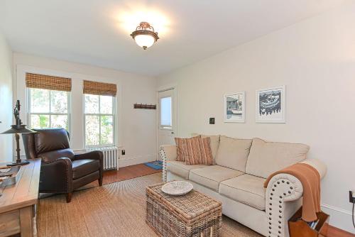 a living room with a couch and a chair at Pigeon Hill in Rockport