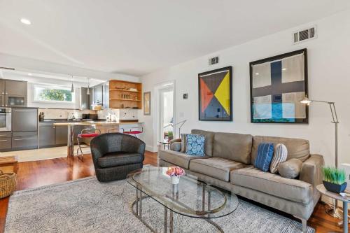 a living room with a couch and a table at Spa Creek Waterfront Pool & Parking in Annapolis