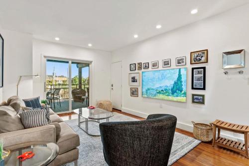 a living room with a couch and a table at Spa Creek Waterfront Pool & Parking in Annapolis