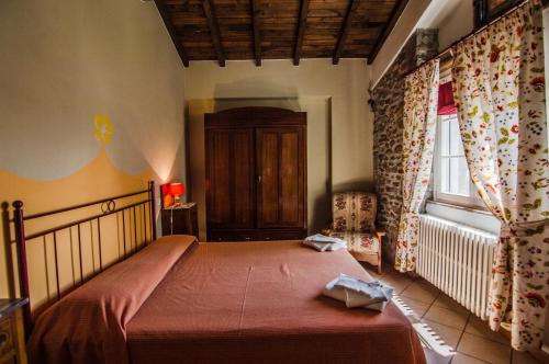 מיטה או מיטות בחדר ב-Agriturismo Chioi
